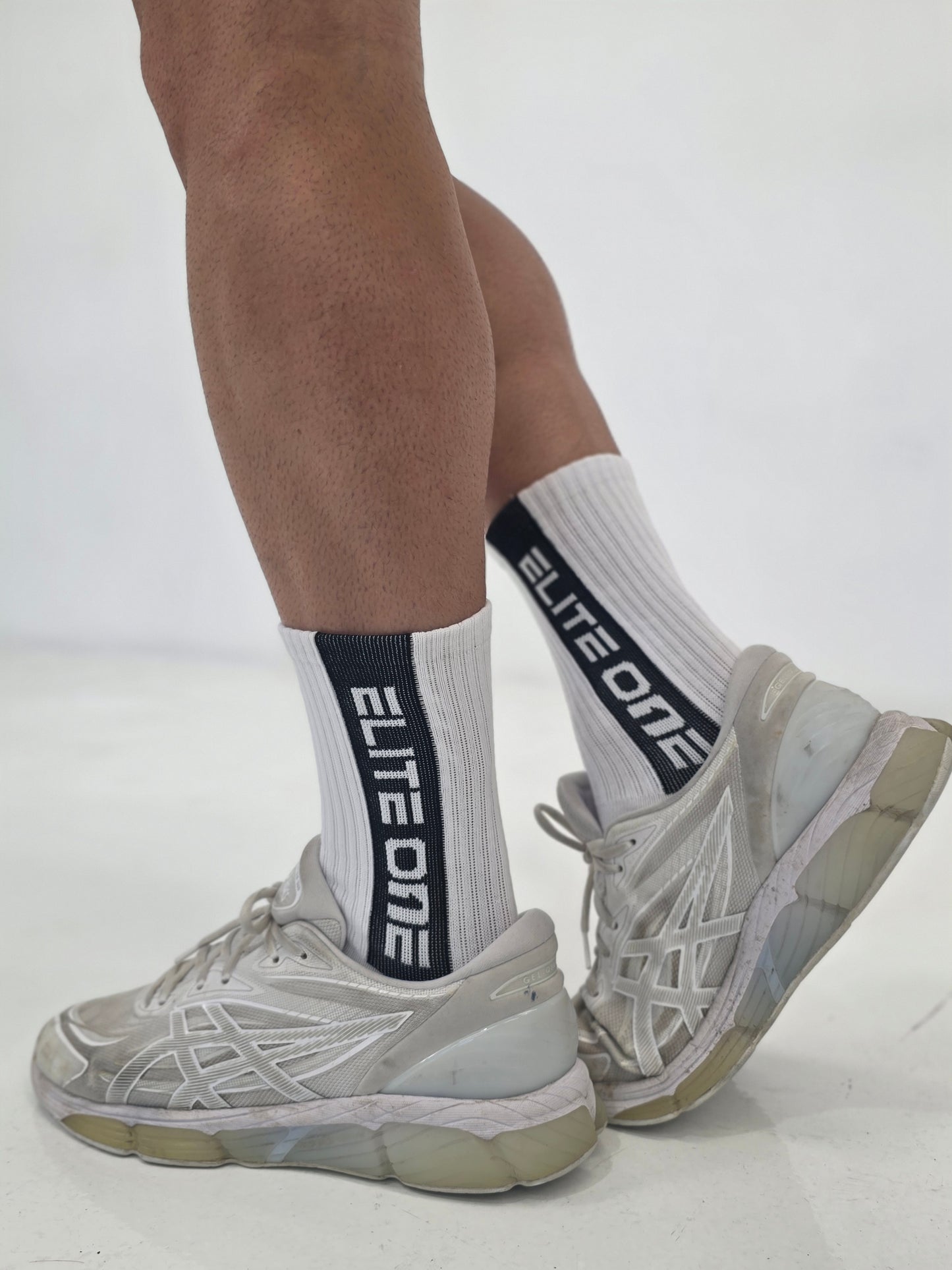 White eliteone black strip socks