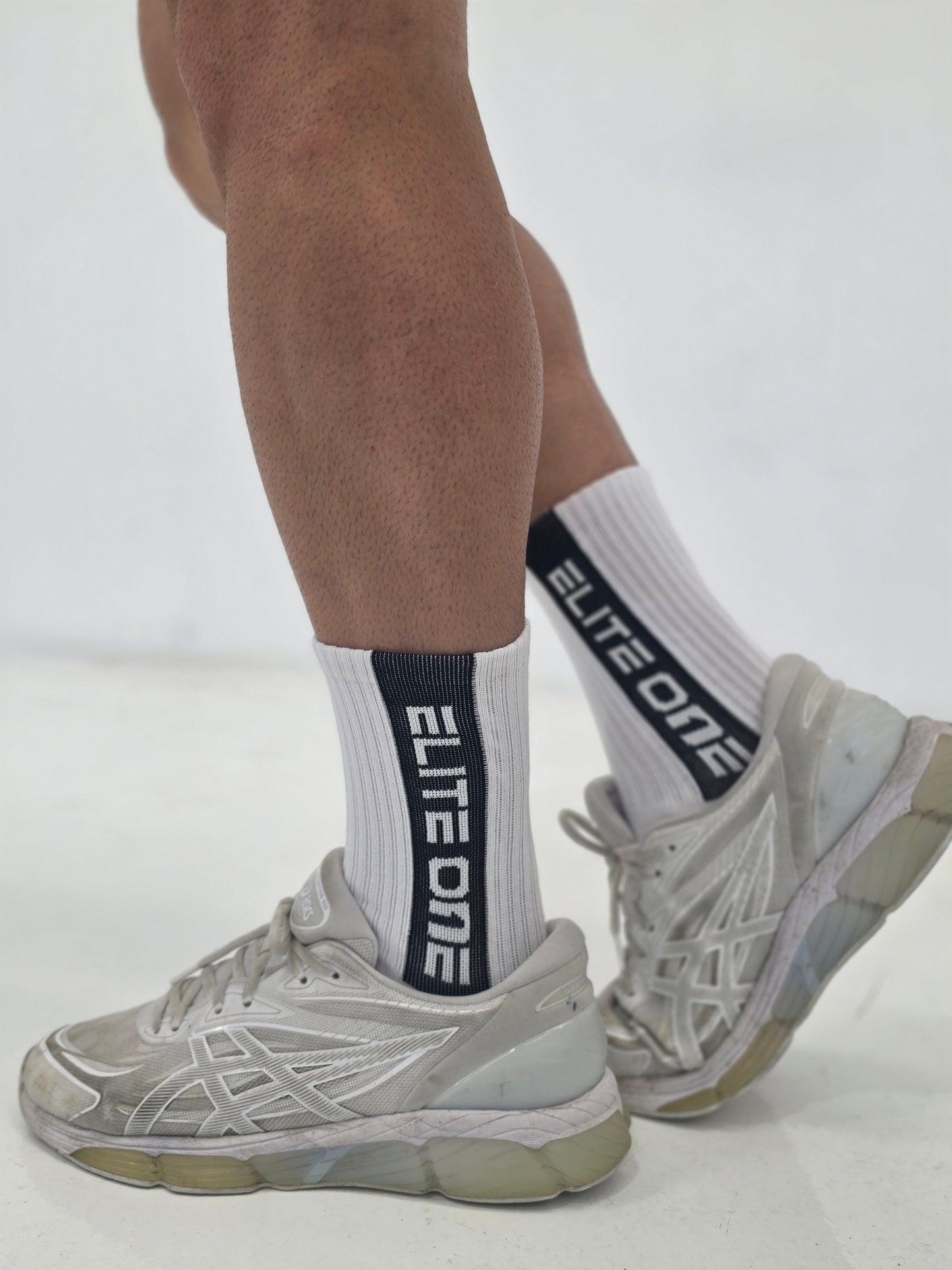 White eliteone black strip socks